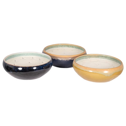 2828 - A group of three large multi-wick candles in ceramic bowls. 31x10cm.