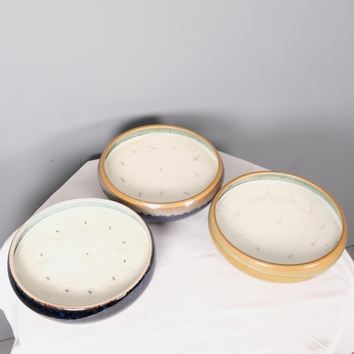 2828 - A group of three large multi-wick candles in ceramic bowls. 31x10cm.