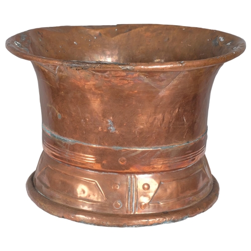 2829 - An Arts & Crafts style spun copper flared rim bowl. 42x28cm.