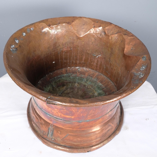 2829 - An Arts & Crafts style spun copper flared rim bowl. 42x28cm.