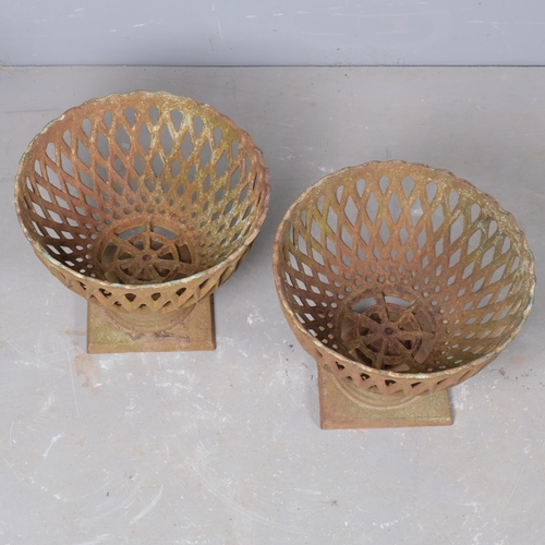 2834 - A pair of small cast iron basket planters, with pierced lattice decoration. 29x22cm.