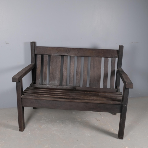 2835 - A stained pine garden bench. Overall 111x86x62cm, seat 99x40x40cm.