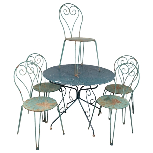 2841 - A painted metal circular topped garden table, 97x74cm, with five matching stacking chairs.