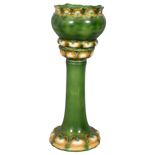 2846 - A Burmantofts style glazed ceramic jardiniere on stand. Height 80cm.