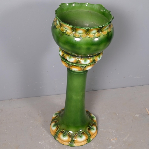 2846 - A Burmantofts style glazed ceramic jardiniere on stand. Height 80cm.