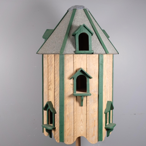 2850 - A modern hand-made pine three-section dovecote on stand. Height 190cm.