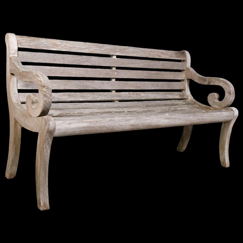 2856 - P J Bridgman & Co. Ltd, Enfield - A weathered teak garden bench. Overall 150x83x60cm.... 