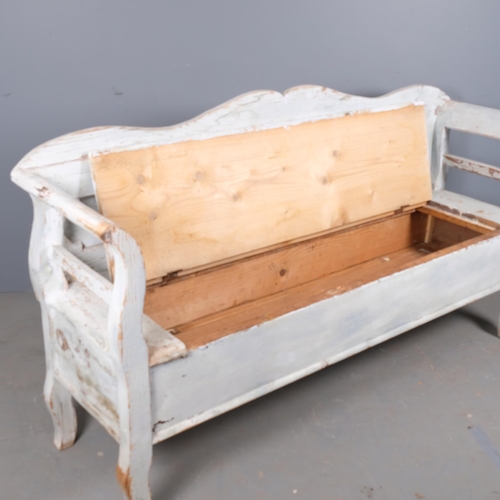 2859 - A painted pine continental style settle, with lifting seat. Overall 180x97x49cm.