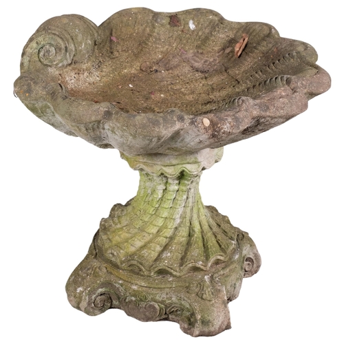 2860 - A weathered concrete two-section shell design birdbath. 54x46cm.