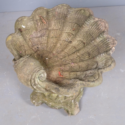 2860 - A weathered concrete two-section shell design birdbath. 54x46cm.