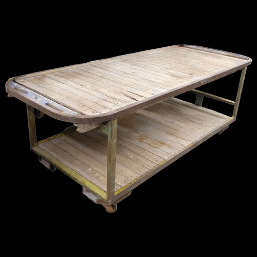 2867 - A very large two-tier industrial work bench / shop display table, with cast iron frame, pine slats a... 