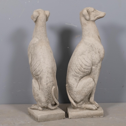 2872 - A pair of concrete whippet garden statues. Height 56cm.