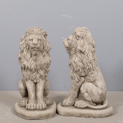 2874 - A pair of concrete garden lion statues. Height 42cm.