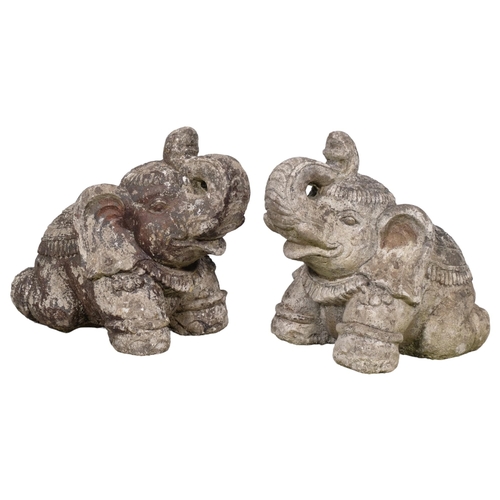 2875 - A pair of weathered concrete garden elephant statues. Height 32cm.