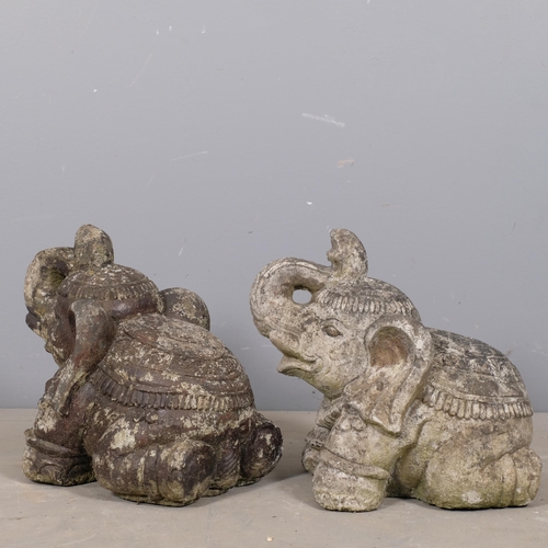 2875 - A pair of weathered concrete garden elephant statues. Height 32cm.