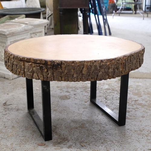 2903 - A live-edge tree slice coffee table on metal sled base. 76x46x72cm.