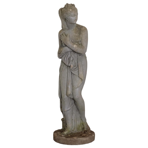 2906 - A reconstituted stone garden sculpture, study of a lady. Height 120cm.