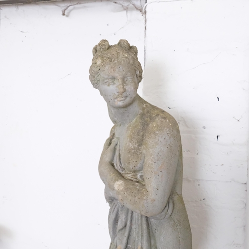 2906 - A reconstituted stone garden sculpture, study of a lady. Height 120cm.