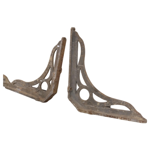 2909 - A pair of extra-large and impressive Victorian cast iron railway station canopy brackets. 120x105cm.