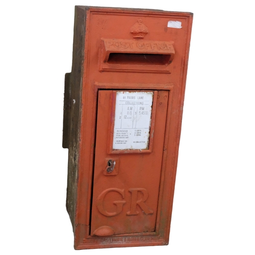 2913 - A Georgian cast iron Royal Mail post box, with enamel panel for 91 Parrs Lane. Overall 35x84x38cm.