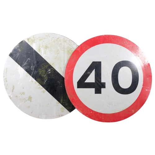 2924 - Two weathered metal road signs. Diameter 121cm.