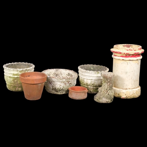 2929 - A terracotta chimney pot, H-60 cm, three concrete planters, two terracotta pots and a concrete stand... 