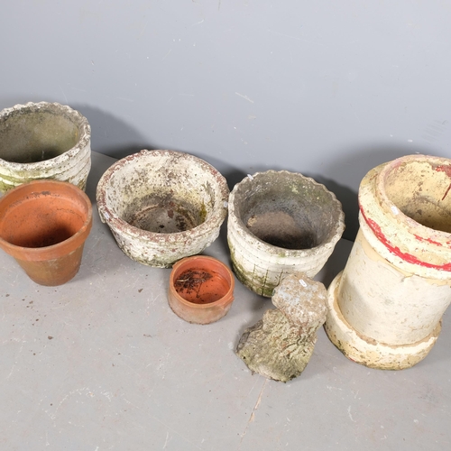 2929 - A terracotta chimney pot, H-60 cm, three concrete planters, two terracotta pots and a concrete stand... 