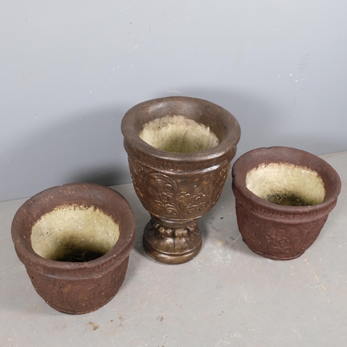 2931 - A two section concrete garden urn on stand, 43x57, and two similar concrete garden urns. (3)