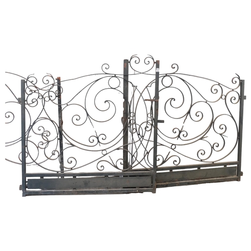 2948 - A pair of painted wrought iron gates, total span 264cm, and a large matching gate, width 231cm.