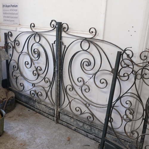 2948 - A pair of painted wrought iron gates, total span 264cm, and a large matching gate, width 231cm.