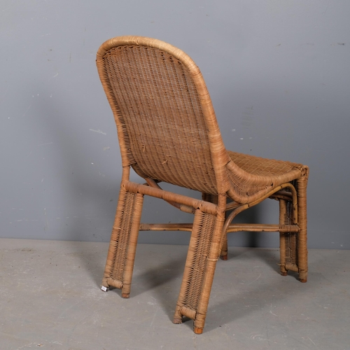 2950 - A mid-century French rattan chair in the manner of Louis Sognot