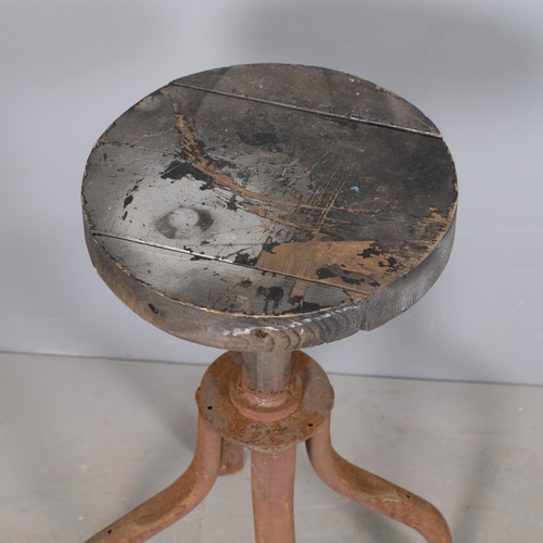 2951 - A mid-century industrial stool, with rise and fall mechanism. Height as photographed 73cm.