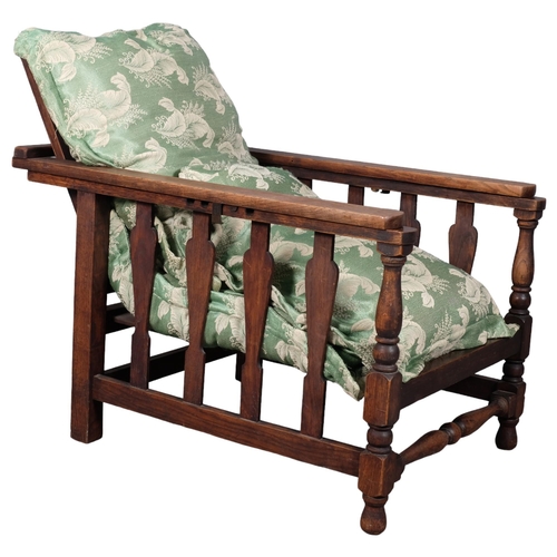 2954 - A teak-framed Plantation chair, with upholstered seat cushions.