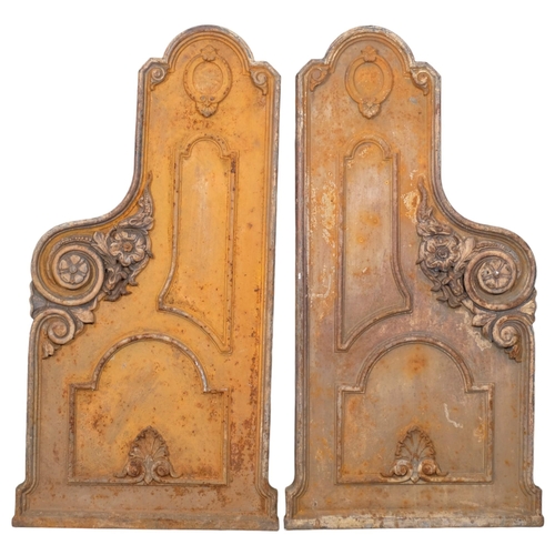 2955 - A pair of Victorian gothic cast iron bench ends, with floral and panelled decoration. 47x99cm.