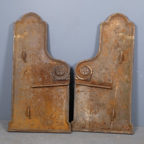 2955 - A pair of Victorian gothic cast iron bench ends, with floral and panelled decoration. 47x99cm.