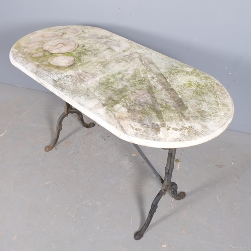 2970 - A weathered oval marble-topped garden table on cast iron frame. 120x72x60cm.