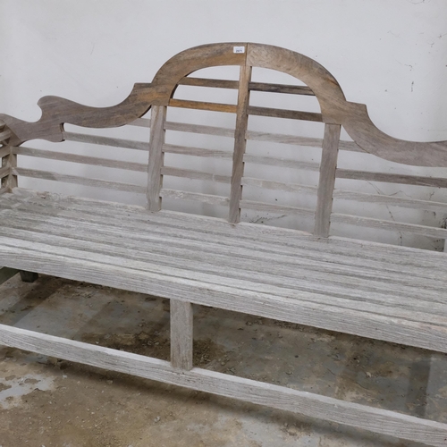 2971 - A teak Lutjens style garden bench. Overall 210x106x60cm.