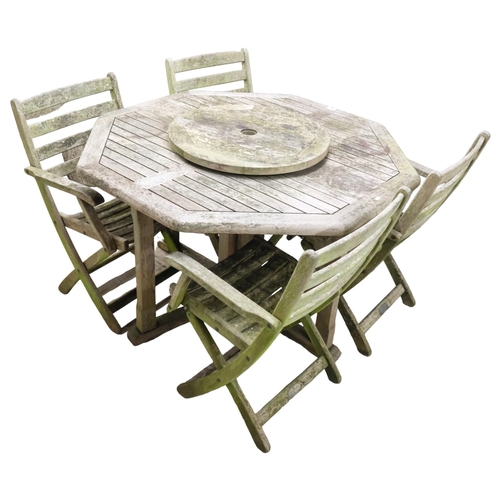 2972 - ALEXANDER ROSE - A weathered teak octagonal drop-leaf garden table and four folding chairs. 120x73cm... 