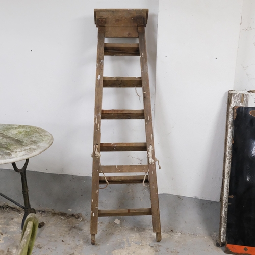 2974 - A vintage folding step-ladder. Height 155cm.