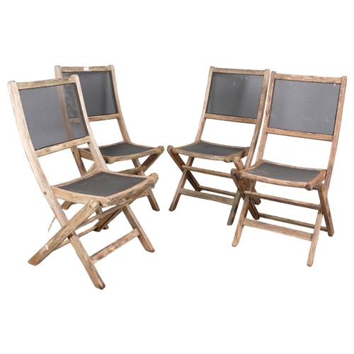 2983 - A set of four weathered teak folding garden chairs, with mesh panelled seats and backs.