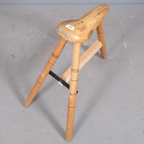 2984 - A handmade bicycle seat design stool on tripod base, by local artist Clive Fredriksson. Height 59cm.