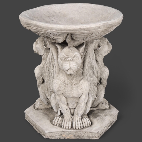 3072 - Curiosity/Macabre : A cast stoneware birdbath, bath is supported by three seated Gargoyles, height 2... 