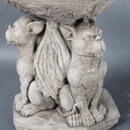 3072 - Curiosity/Macabre : A cast stoneware birdbath, bath is supported by three seated Gargoyles, height 2... 