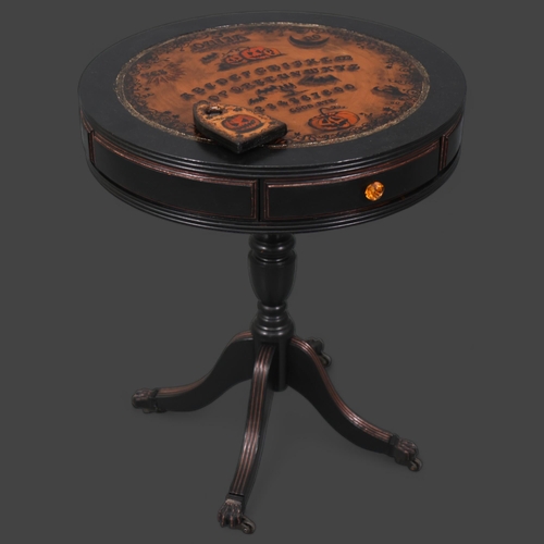 3115 - Curiosity/Macabre : A Ouija board pumpkin design drum table, with planchette, 50cm x 60cm, planchett... 