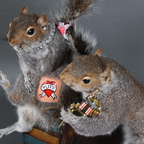 3127 - Taxidermy: Pair of Tattooing Squirrels. The tattooist squirrel holding a miniature tattoo gun in one... 