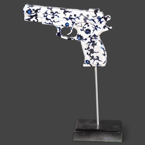 3164 - Curiosity/Macabre : An abstract study, pistol sculpture, on stand, unsigned, height 32cm.