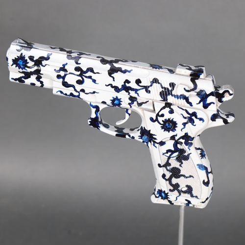 3164 - Curiosity/Macabre : An abstract study, pistol sculpture, on stand, unsigned, height 32cm.