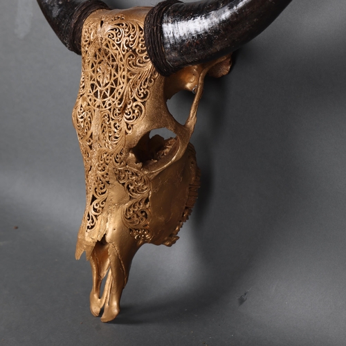 3166 - Taxidermy: Carved Water Buffalo Skull painted gold.
An impressive water buffalo cranium and horns. T... 