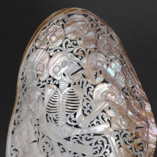 3221 - Natural History: Hand-carved River Mussel Mother of Pearl Shell with Skeleton and skulls
A polished,... 