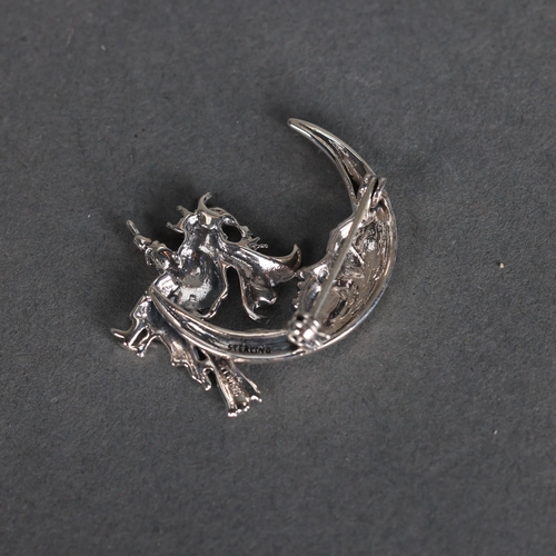 3241 - Curiosity/Macabre: Silver Brooch in the form of a witch on broomstick in crescent moon. Marked sterl... 